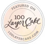Badge featuring '100 Layer Cake' on a white background