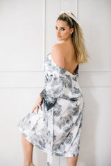 Woman wearing a floral dress with a white background