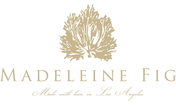 Madeleine Fig logo with leaf design on a white background